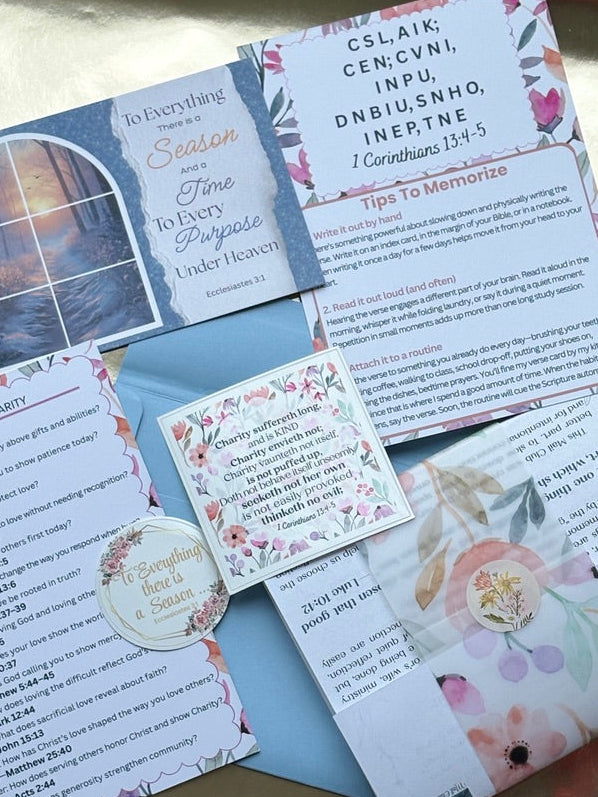 Set of prayer cards with floral designs and text on a textured surface